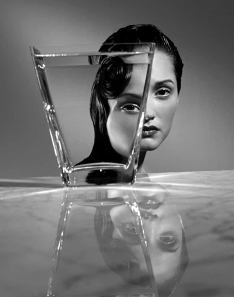 Artistic Black and White Background: Woman’s Face in Water Reflection Wallpaper