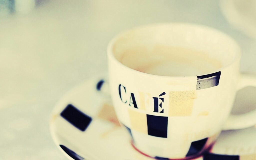 Artistic Coffee Cup Wallpaper: Cozy Design & Inviting Aesthetic