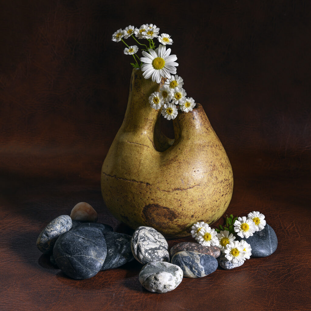 Daisy Wallpaper: Rustic Vase & Stones for a Serene Background