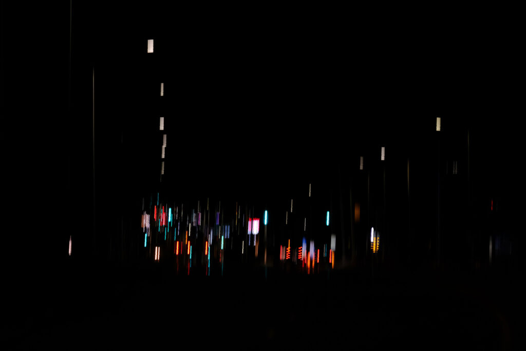 Artistic Dark Background with Blurred Multicolored Glowing Lights Wallpaper