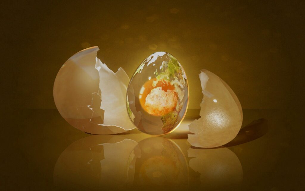 Artistic Egg Wallpaper: Cracked Shell with Inner Landscape Glow