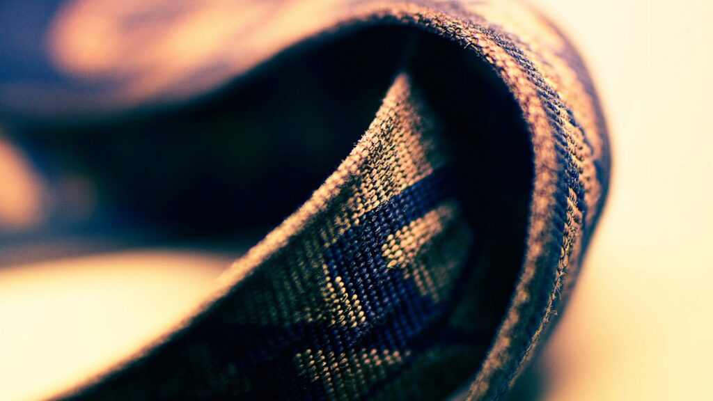 Textured Fabric Belt Wallpaper: Intricate Details & Artistic Background