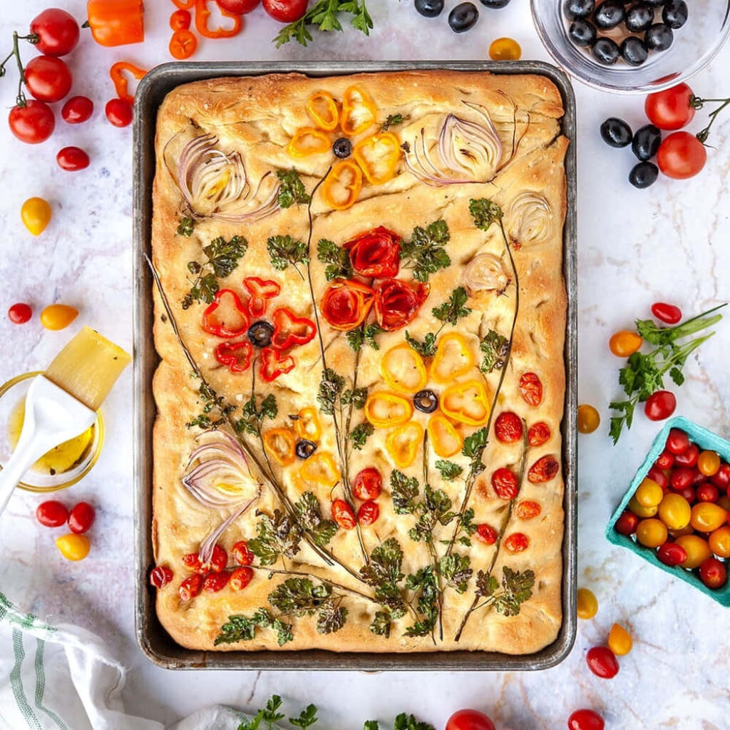 Artistic Focaccia Bread with Cherry Tomatoes & Fresh Ingredients Wallpaper