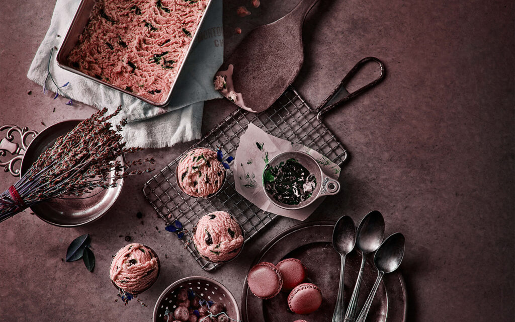 Artistic Dessert Table with Muffins, Macarons & Rustic Props Wallpaper
