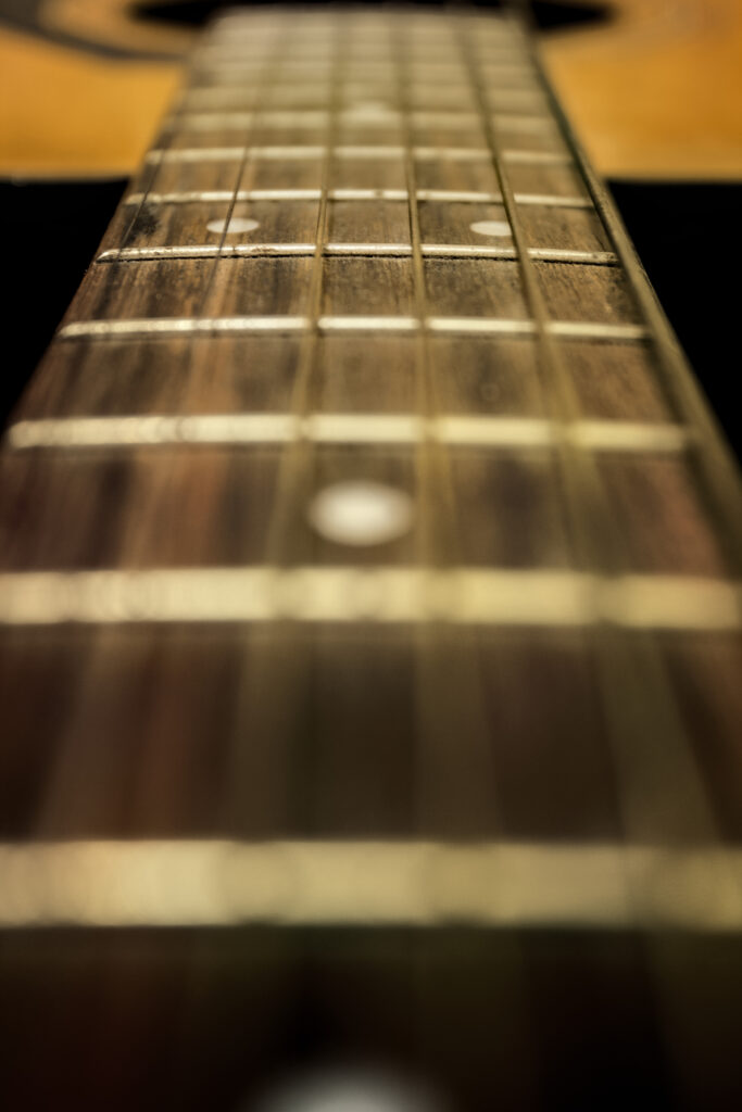 Artistic Close-Up of Guitar Neck and Fretboard - Music Wallpaper