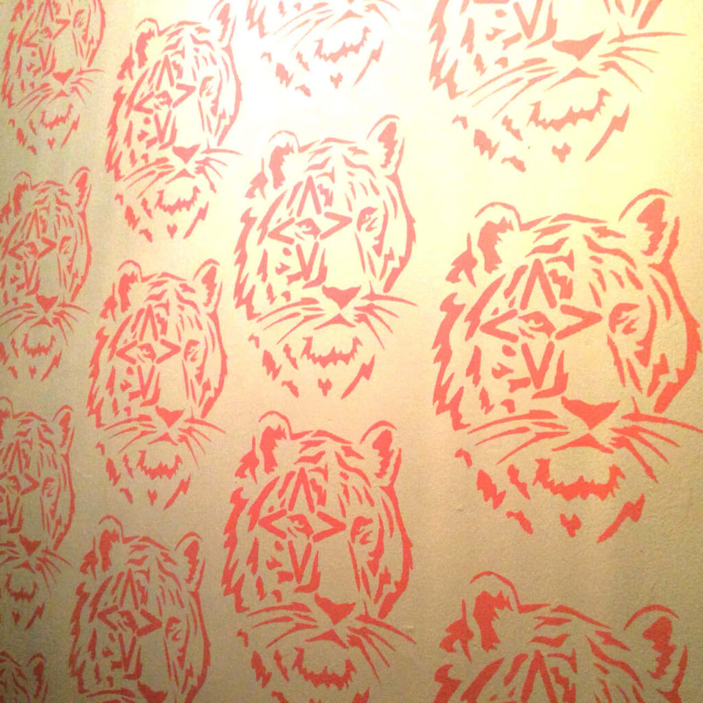 Bold Tiger Pattern Wallpaper: Artistic Design in Soft Orange Hue
