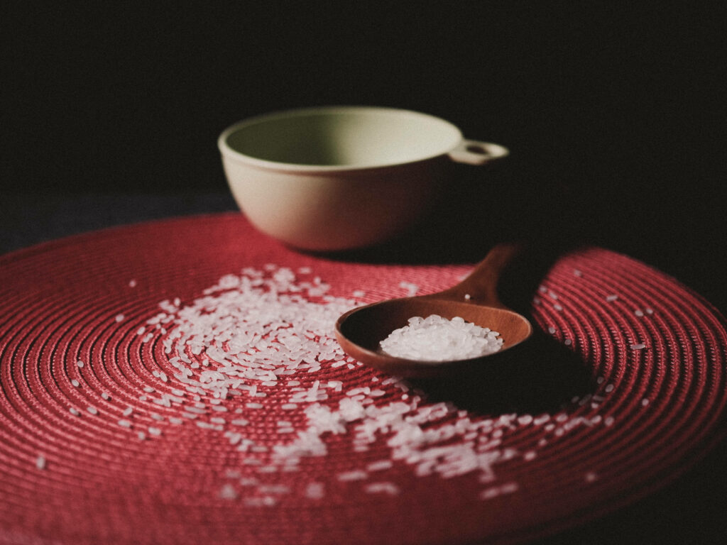 Minimalist Wallpaper: Wooden Spoon, Bowl & Scattered Rice Art