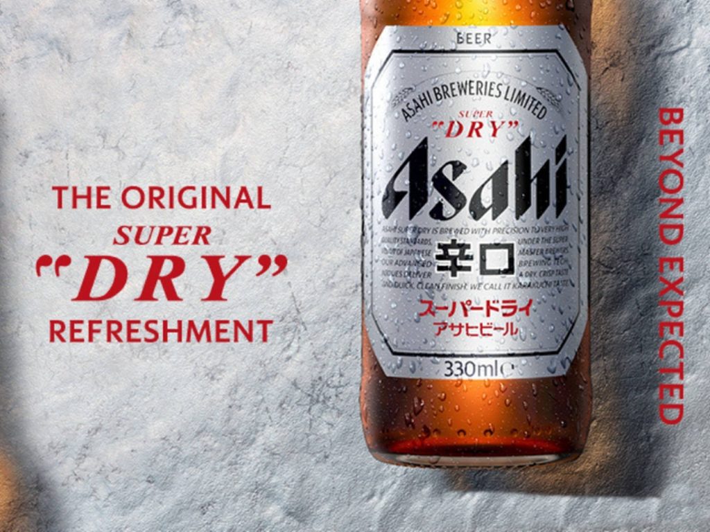 Asahi Super Dry beer bottle with condensation bold red slogans textured grey background wallpaper
