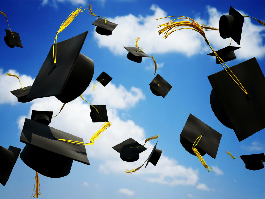 Ascension Amidst Golden Dreams: Captivating Graduation Backdrop Wallpaper