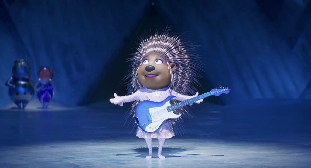 Ash the Porcupine Rocks Out on Stage - Vibrant Wallpaper Background