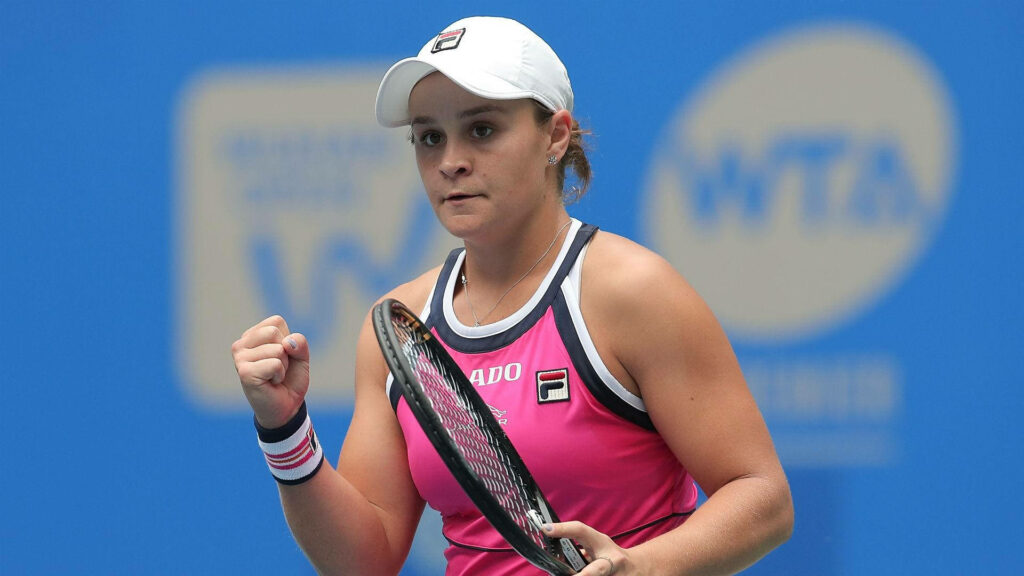 Ashleigh Barty showing fierce determination and athleticism in dynamic tennis action wallpaper