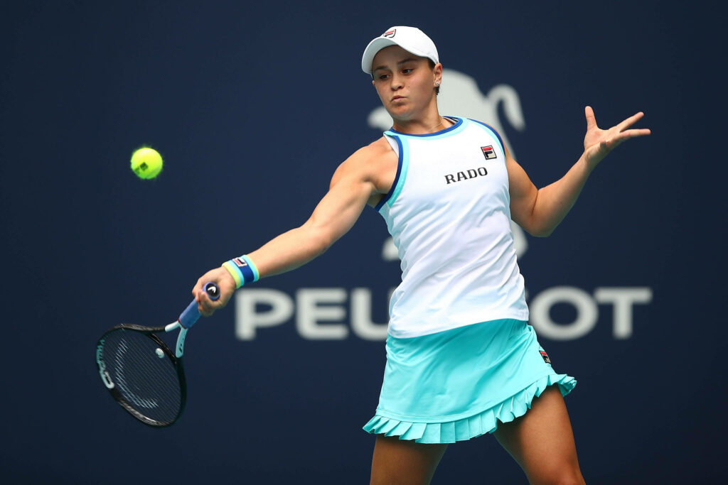 Ashleigh Barty returning a shot with intense focus and athleticism at Miami Open match wallpaper