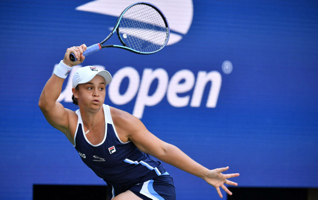 Ashleigh Barty intense tennis action on court showcasing athletic skill and focus wallpaper