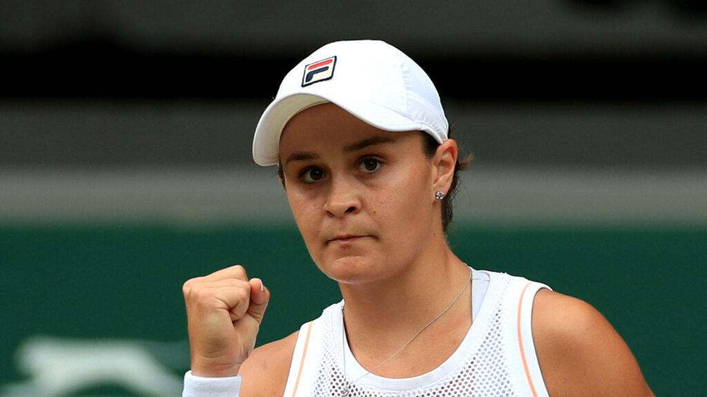 Ashleigh Barty celebrates victory on tennis court showing determination and triumph wallpaper