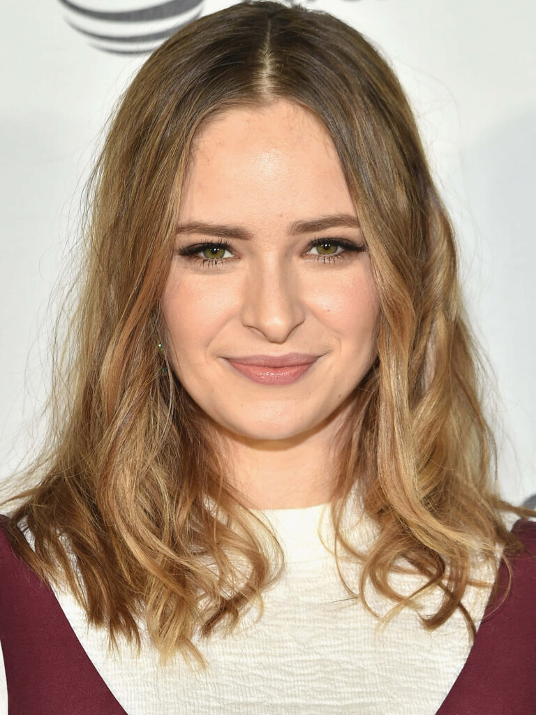 Ashleigh Cummings radiant and confident in elegant wallpaper celebrating rising star status