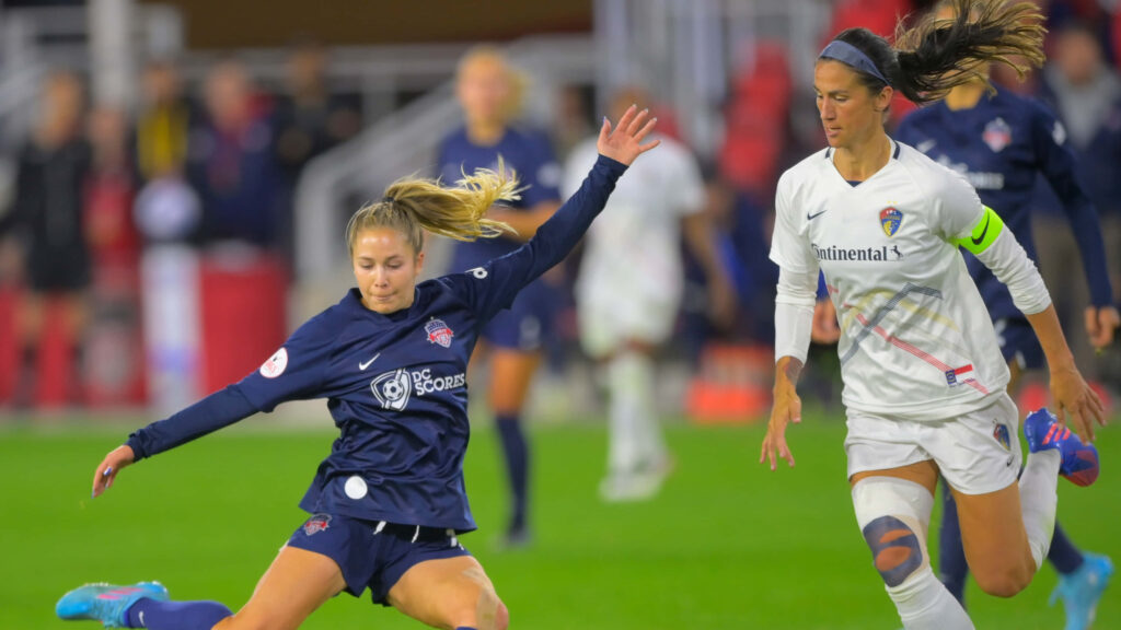 Ashley Sanchez in action on soccer field showing skill determination during intense match wallpaper