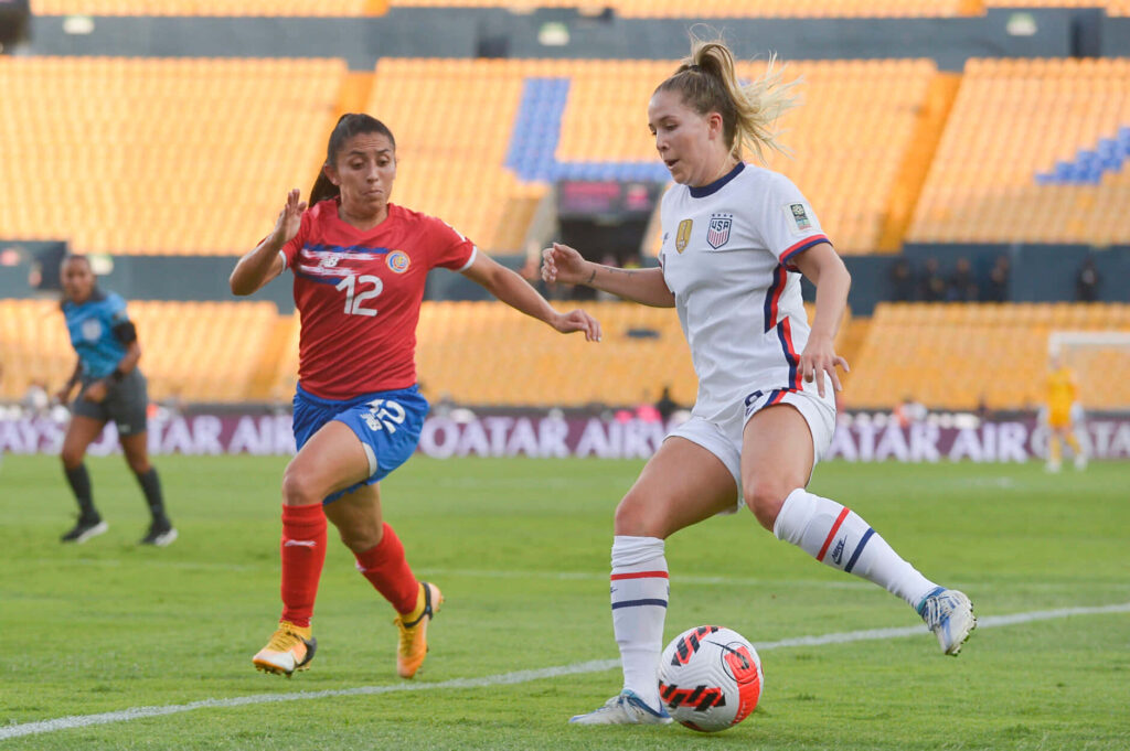 Ashley Sanchez controlling soccer ball skillfully during intense competitive match action wallpaper