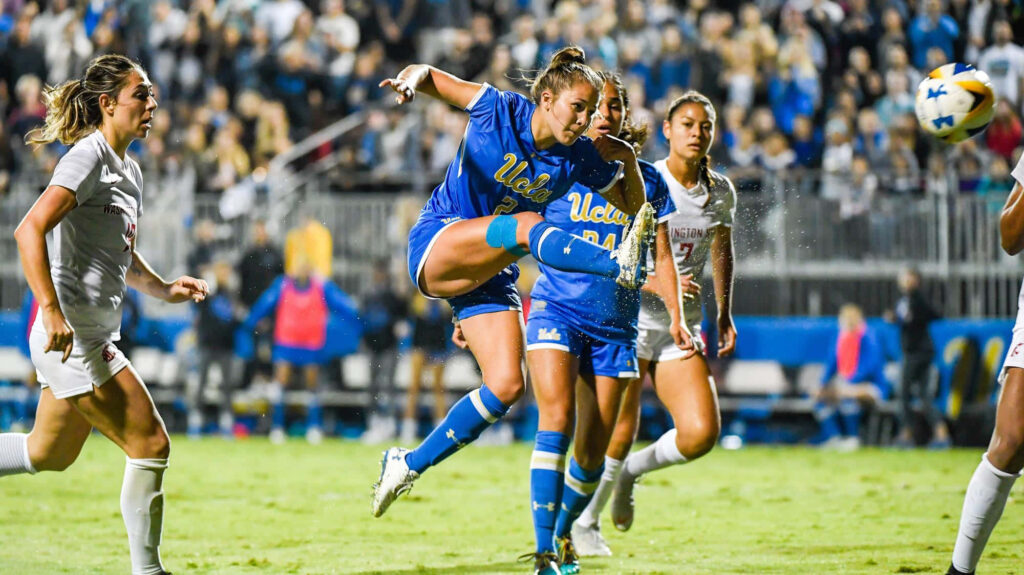 Ashley Sanchez striking soccer ball with skill and determination in competitive match wallpaper