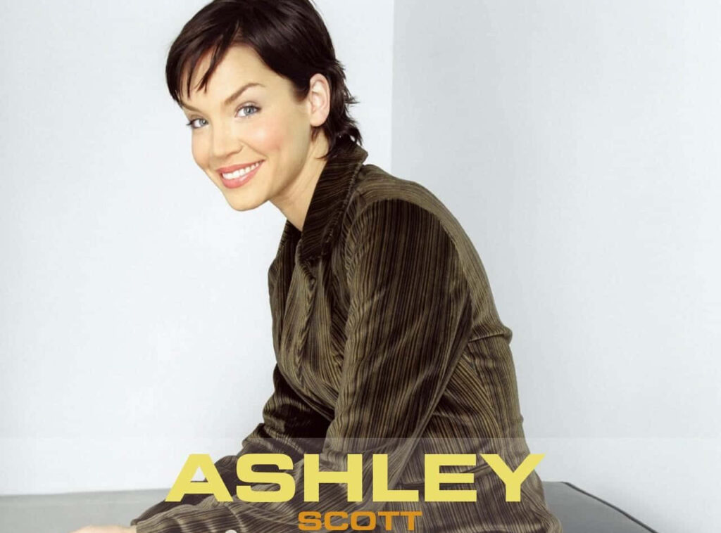 Ashley Scott stylish portrait wallpaper smiling confidently against minimal background
