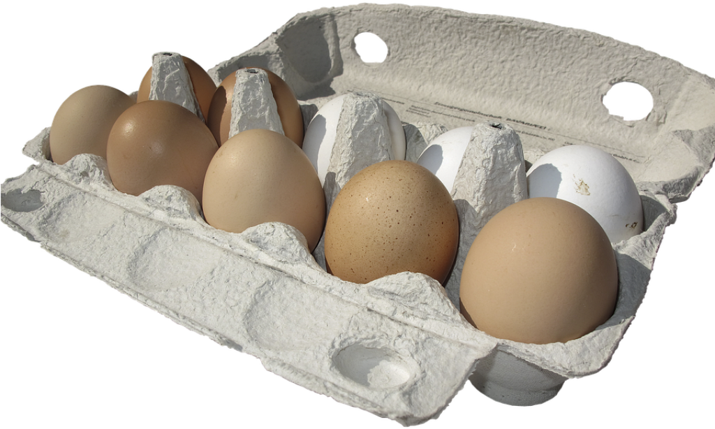 Vibrant Egg Carton: Assorted Brown & White Eggs on Cardboard Tray Wallpaper