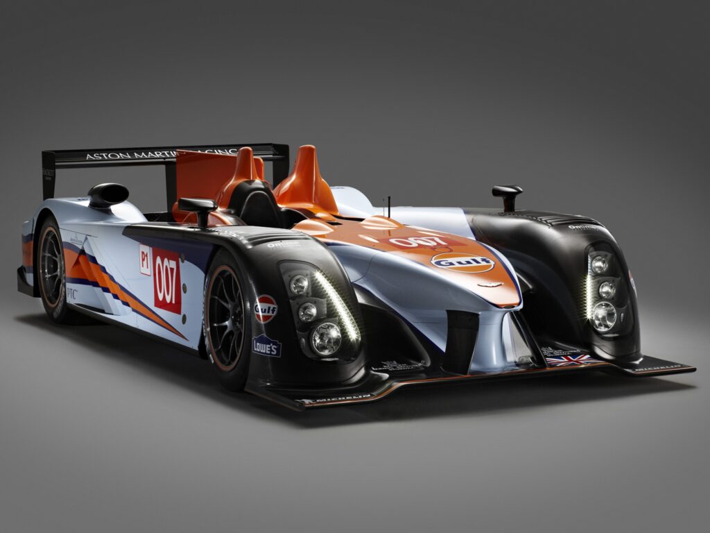 Sleek Aston Martin AMR-One LMP1 Wallpaper: Dynamic Black & Orange Design