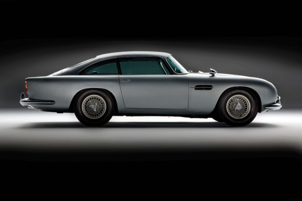 Aston Martin DB5 classic car wallpaper showcasing timeless elegance and sleek studio design