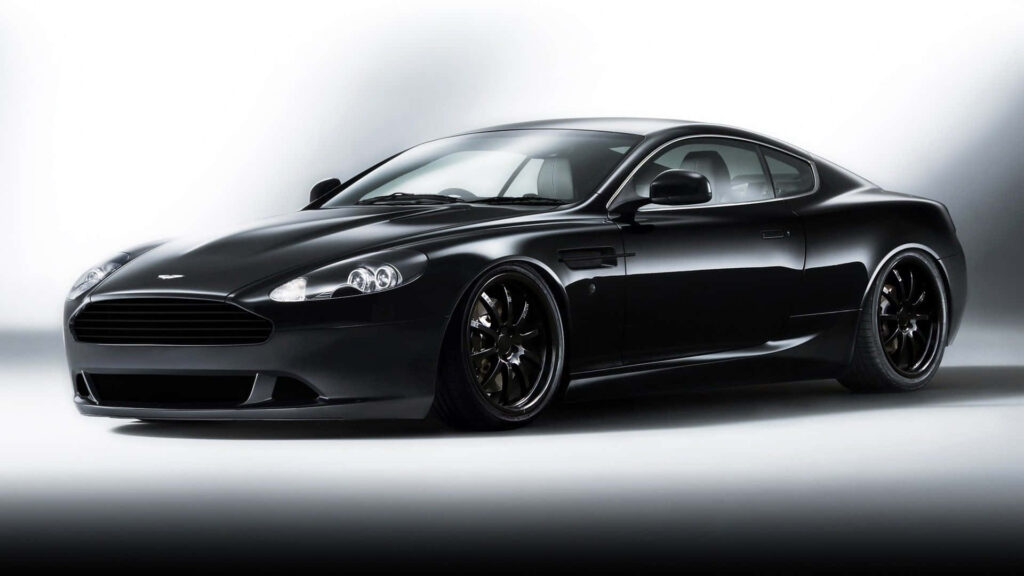 Aston Martin DB9 sleek black luxury sports car wallpaper high performance engineering background