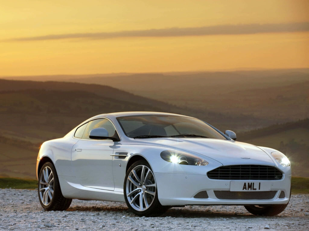 Aston Martin DB9 white sports car at sunset luxury performance wallpaper background