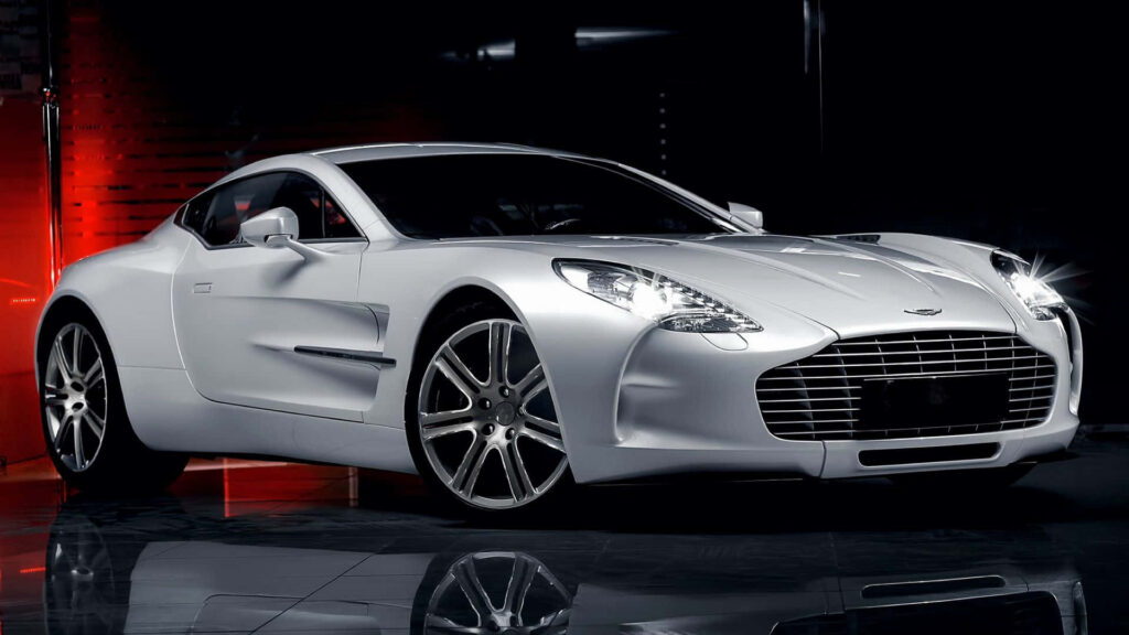 Aston Martin One 77 sleek silver luxury car with sculpted design high performance wallpaper background