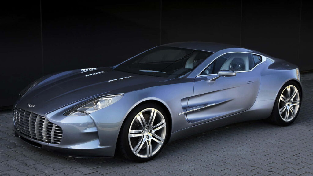Aston Martin One-77 sports car with sleek lines and luxurious design shining under light wallpaper