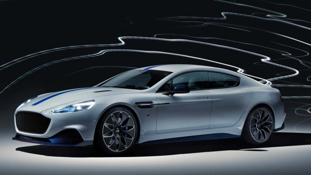 Aston Martin Rapide S speeding with vibrant light trails showcasing sleek sporty design Wallpaper