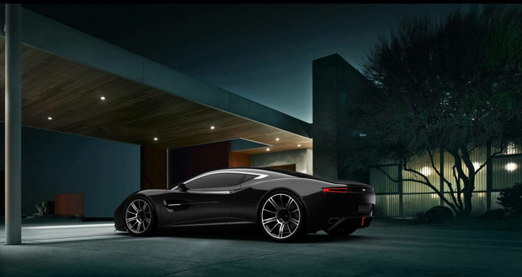 Sleek Aston Martin sports car parked outside modern home at night with glowing soft lights Wallpaper