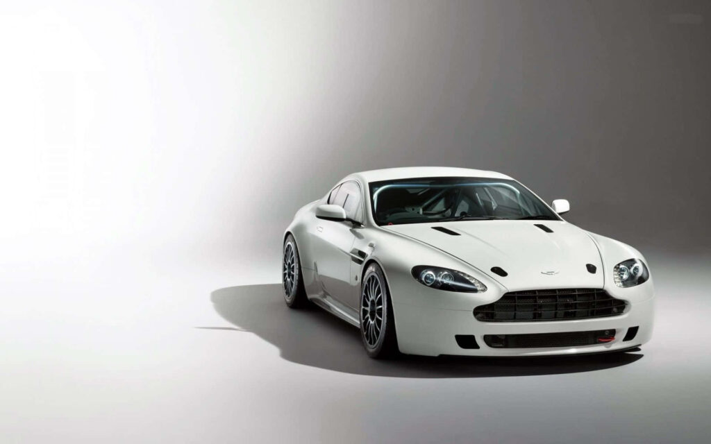 Aston Martin V12 Vantage in minimalist setting highlighting aggressive design and performance details Wallpaper