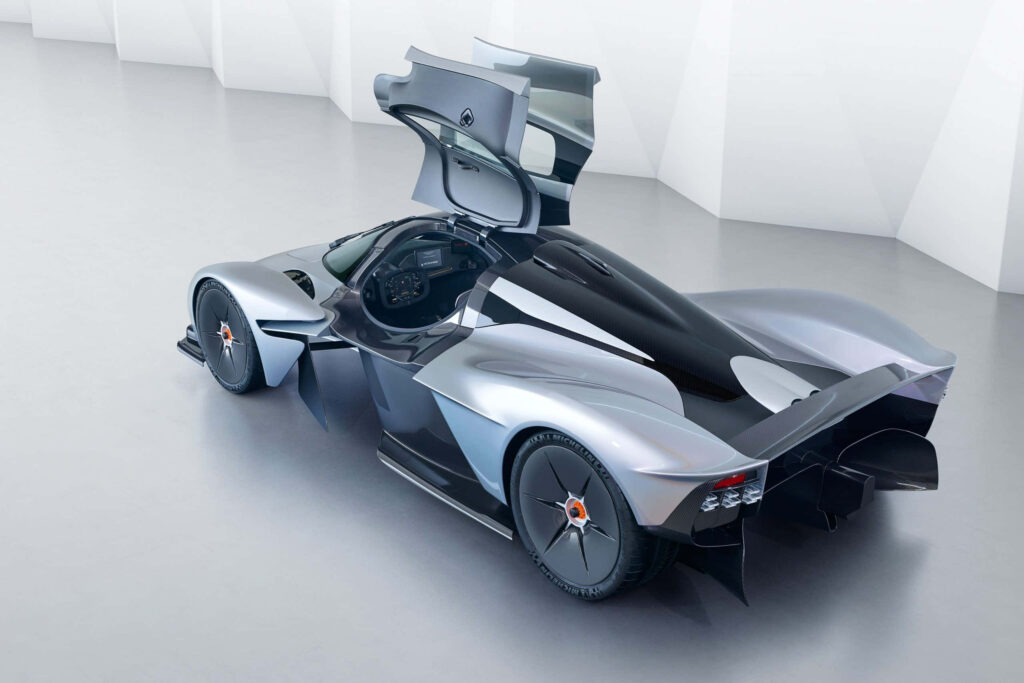 Aston Martin Valkyrie with open gullwing doors showcasing futuristic design and aerodynamics wallpaper