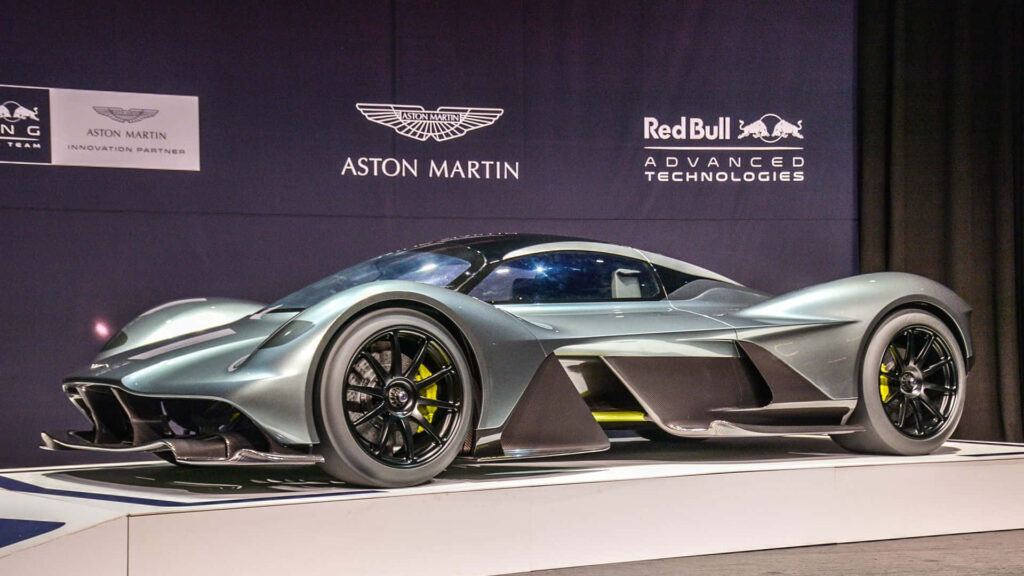 Aston Martin Valkyrie supercar in modern setting showcasing futuristic design and aerodynamic excellence Wallpaper