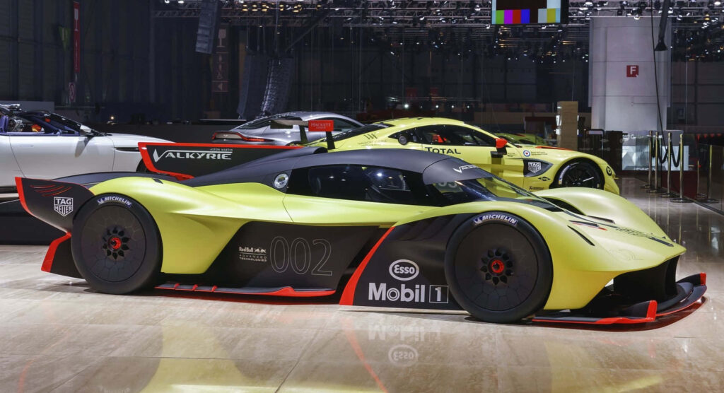 Aston Martin Valkyrie hypercar in sleek showroom highlighting aerodynamic design and performance Wallpaper