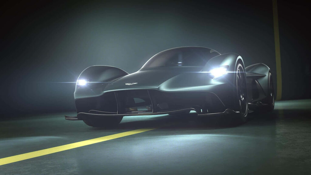 Aston Martin Valkyrie hypercar illuminated with sleek lighting showcasing modern design wallpaper