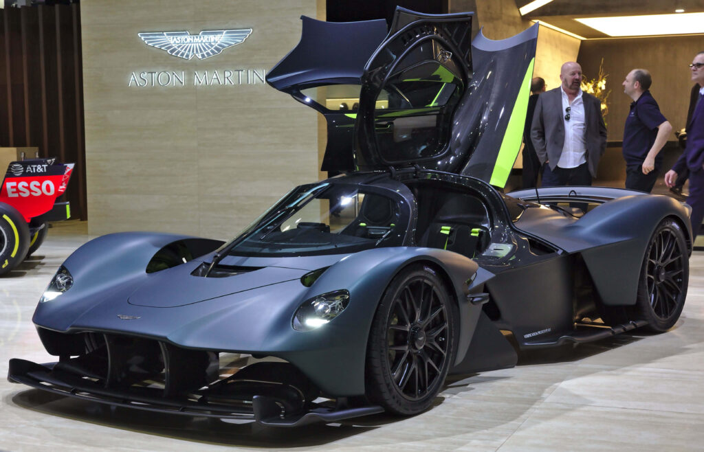 Aston Martin Valkyrie hypercar with gullwing doors open showcasing aerodynamic luxury design Wallpaper