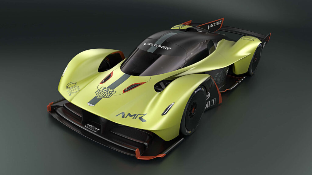 Aston Martin Valkyrie lime green sports car with sleek aerodynamic design on dark background Wallpaper