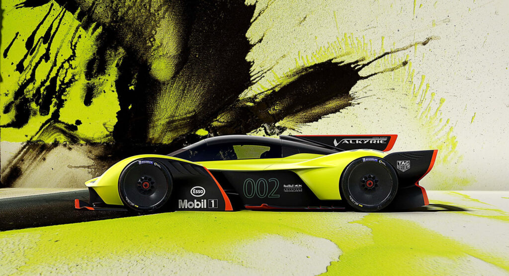Aston Martin Valkyrie hypercar side view yellow black abstract racing design wallpaper