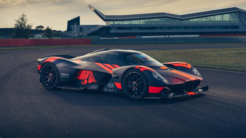 Aston Martin Valkyrie on racetrack showing aerodynamic design and advanced engineering wallpaper