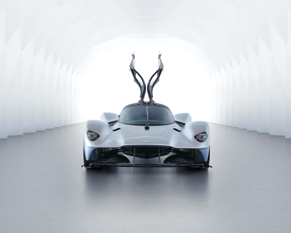 Aston Martin Valkyrie with open signature doors showcasing futuristic design and engineering Wallpaper