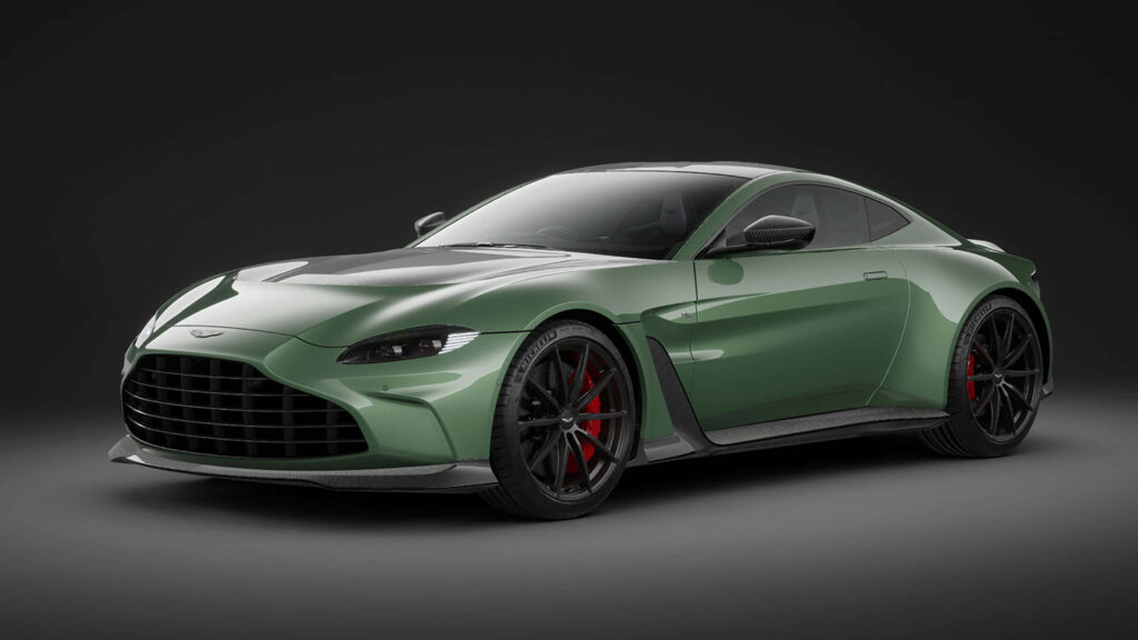 Aston Martin Vantage sports car in sleek green with aggressive stance and dramatic lighting wallpaper