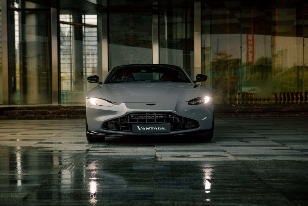 Aston Martin Vantage sleek modern design parked on polished urban road luxury sports car wallpaper