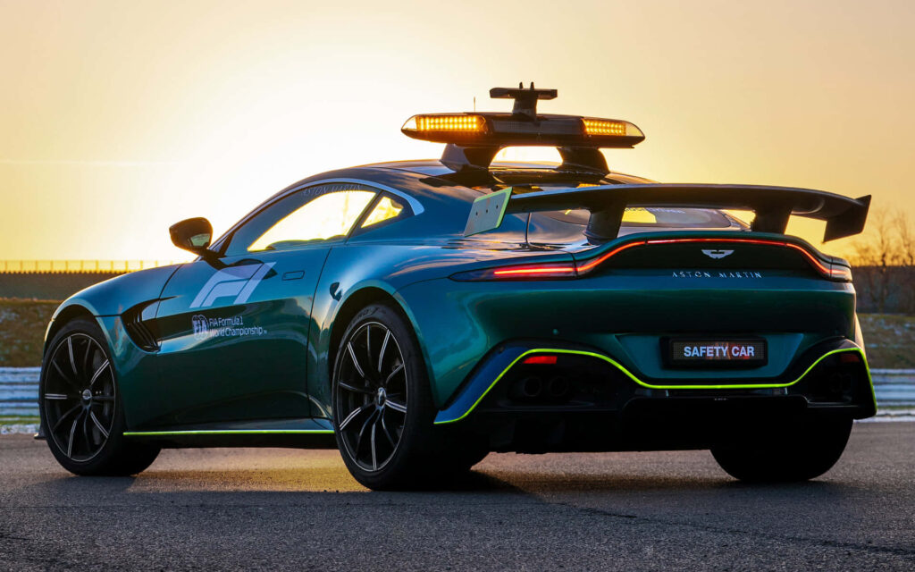 Aston Martin Vantage Safety Car Wallpaper at Sunset - Sleek Design
