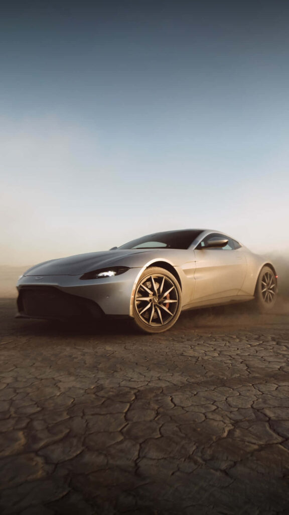 Aston Martin Vantage Wallpaper: Luxury Meets Rugged Terrain