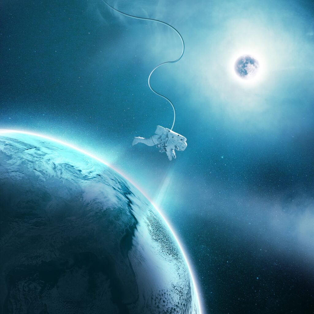 Stunning Astronaut Wallpaper: Cosmic Scene with Planet & Star Light
