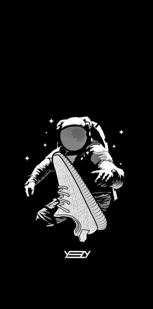 Astronaut floating in space with YEEZY sneaker showcasing latest YEEZY Seasons Collection wallpaper