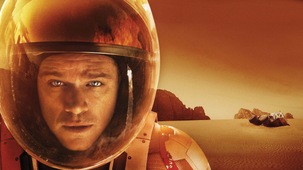 Astronaut Mark Watney in helmet on desolate Mars with stranded habitat in The Martian wallpaper