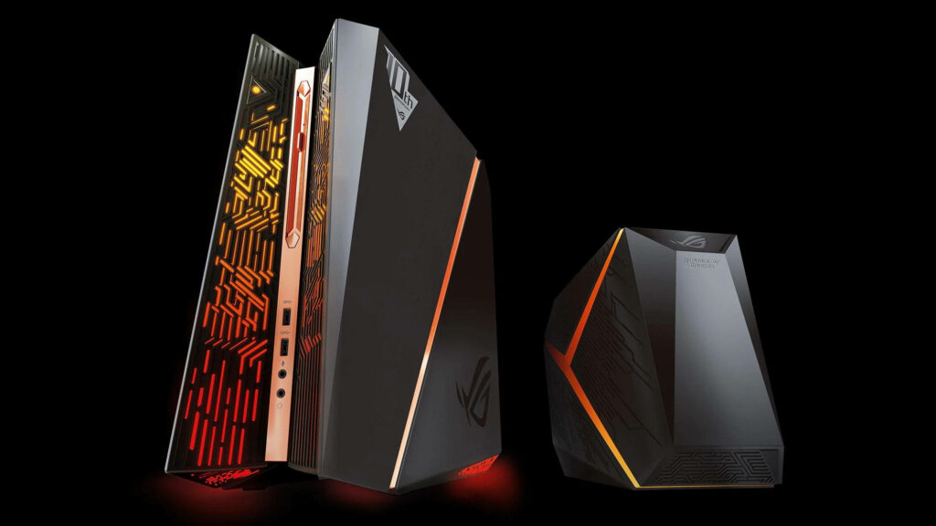 Asus ROG gaming PCs with angular design and vibrant orange LED lights on dark background Wallpaper